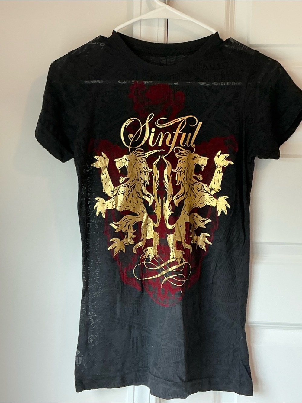 Sinful women’s Black BURNOUTS  Short-Sleeve Tee with Gold Crest and Red Accent